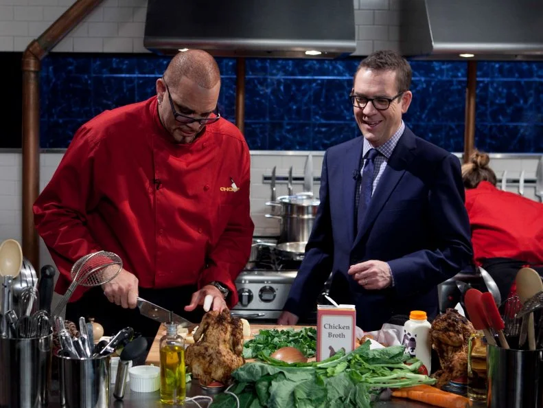 Chopped host Ted Allen checks in on celebrity Sinbad while he works on his entree that must include: beer can chicken, jalapeno poppers, collard greens and truffle honey, as seen on Food Networkâ  s Chopped, Season 19.