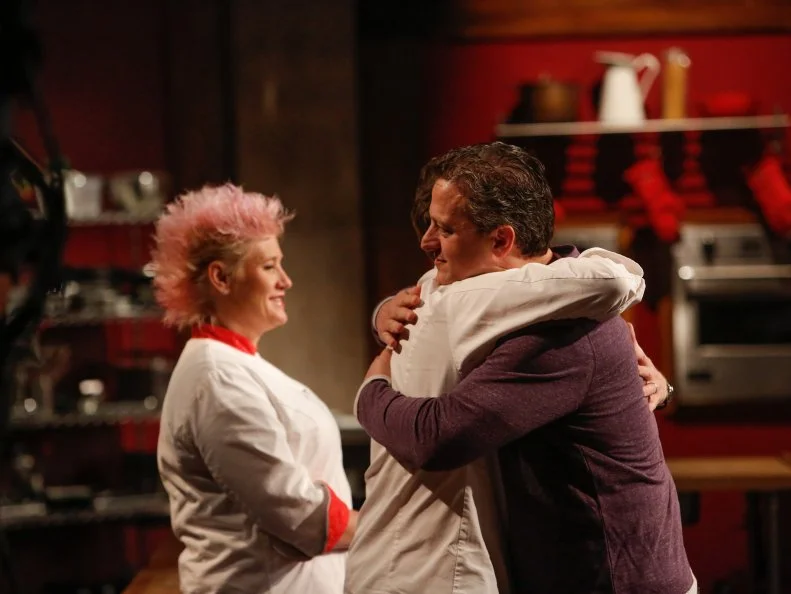 BlueTeam recruit Daniel Beyda to Blue Team Leader Chef Bobby Flay and  as Blue Team recruit Amber Brauner is by the chefs as the from the Blue Team of the Feed the Family Challenge, as seen on Food Network's Worst Cooks in America, Season 5.
