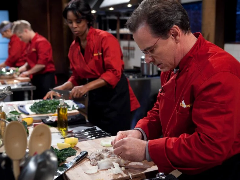Celebrities: Peter Scolari, Tasha Smith, Lucas Grabeel and Michael Imperioli working on their appetizers that must include: squid, dinosaur kale, popcorn on the cob and candy blood, as seen on Food Networkâ  s Chopped, Season 19.