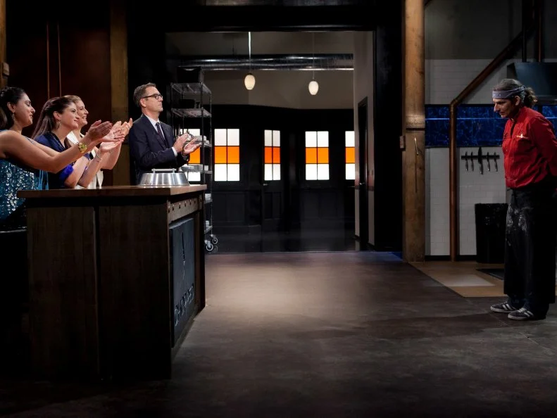 Chopped host Ted Allen and judges: Amanda Freitag, Alex Guarnaschelli and Maneet Chauhan congratulate celebrity Michael Imperioli upon winning the fourth round of the Chopped Celebrity Challenge and a spot in the $50,000 finale, as seen on Food Networkâ  s Chopped, Season 19.
