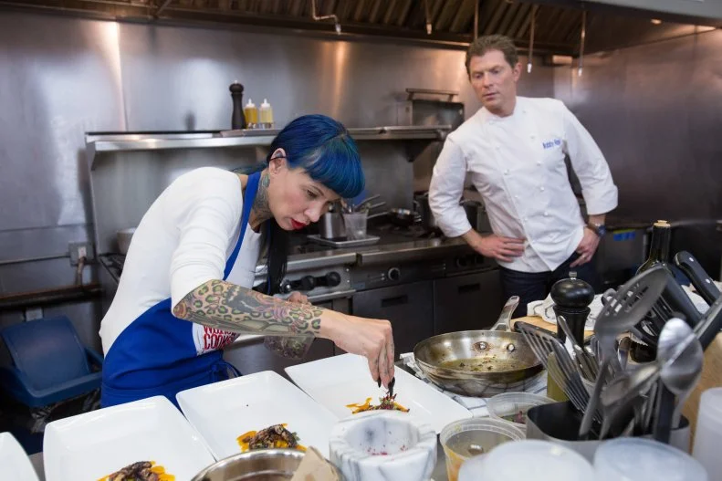 Chef Bobby Flay watches as finalist  Amber Brauner cooks  for the final episode as seen on Food Network's Worst Cooks in America, Season 5.
