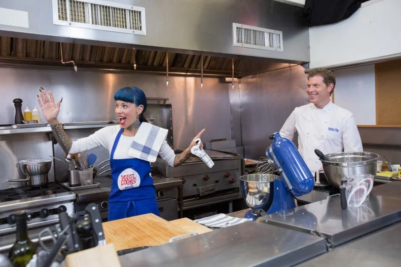 Chef Bobby Flay and finalist Amber Brauner joke around in the kitchen duringg the final episode as seen on Food Network's Worst Cooks in America, Season 5.