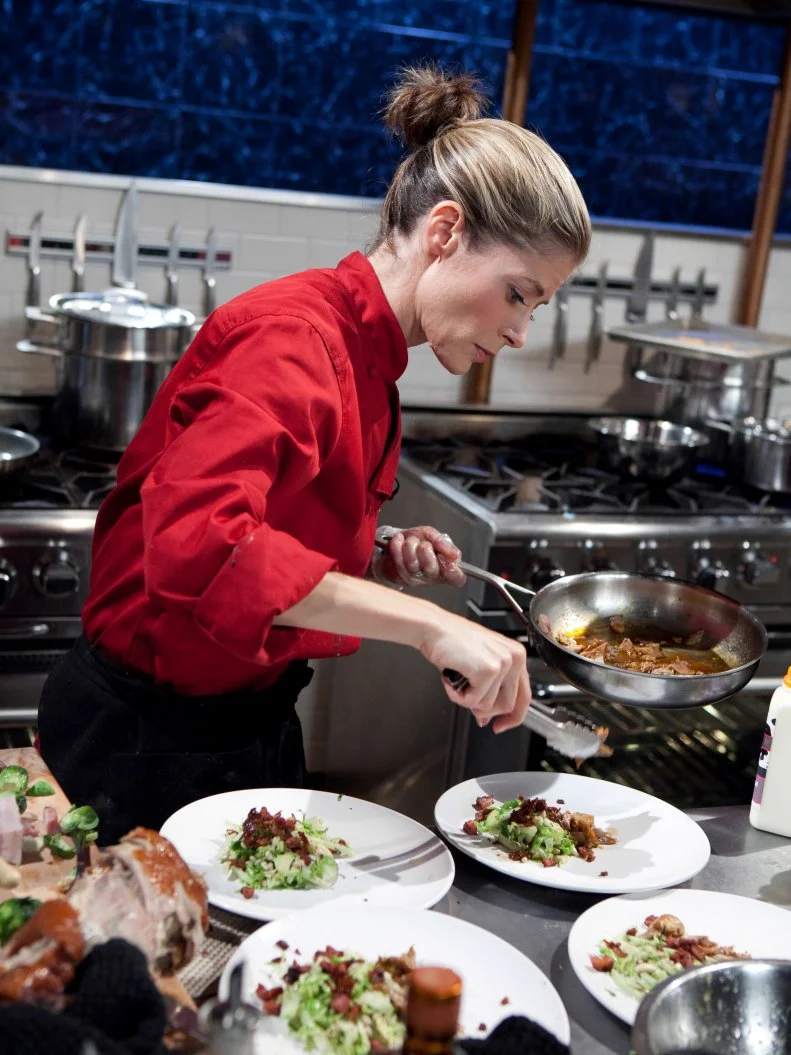 Celebrity Gillian Vigman working on her entree that must include: Peking duck, Brussels sprouts on the stalk, cotton candy and veal demi-glace, as seen on Food Networkâ  s Chopped, Season 19.