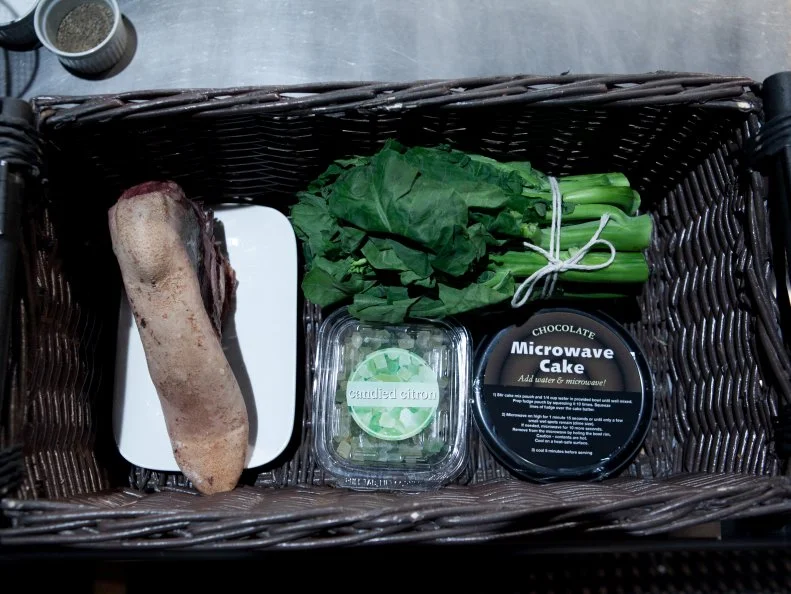 The mystery basket ingredients for the appetizer round are: beef tongue, candied citron, chinese broccoli, microwave chocolate cake, as seen on Food Network's Chopped, Season 19.