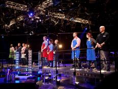Down to seven remaining contestants, cooks and chefs line up on the catwalk before the beginning of the third round, as seen on Food Network's America's Best Cook, Season 1.