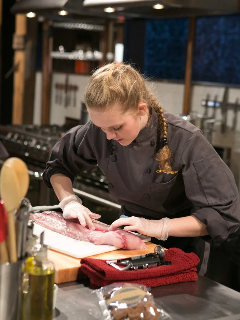 Teen Competitor Ashley Dudley (16)  working on her entree that must include: mahi-mahi, cookie chips, green beans and french fries, as seen on Food Network's Chopped, Season 21.