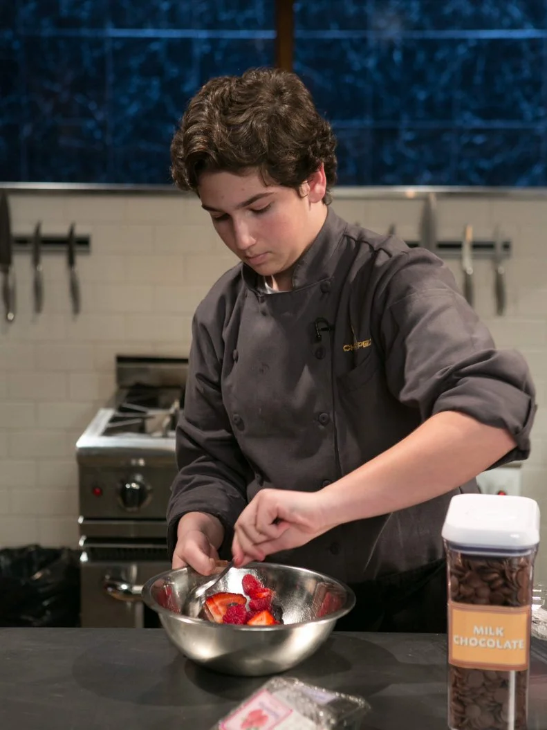 Teen competitor Jason Khaytin (14) working on his dessert that must include: gourmet frozen yogurt, white balsamic vinegar, puffed rice cereal bars and dolce de leche, as seen on Food Network's Chopped, Season 21.