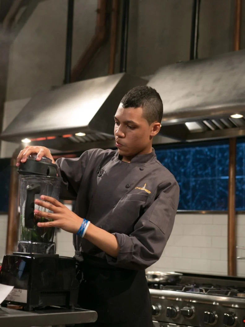 Teen competitor Jay Urena (16) as he works on his entree that must include: mahi-mahi, cookie chips, green beans and french fries, as seen on Food Network's Chopped, Season 21.