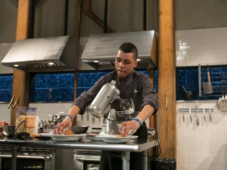 Teen competitor Jay Urena (16) working on his dessert that must include: gourmet frozen yogurt, white balsamic vinegar, puffed rice cereal bars and dolce de leche, as seen on Food Network's Chopped, Season 21.