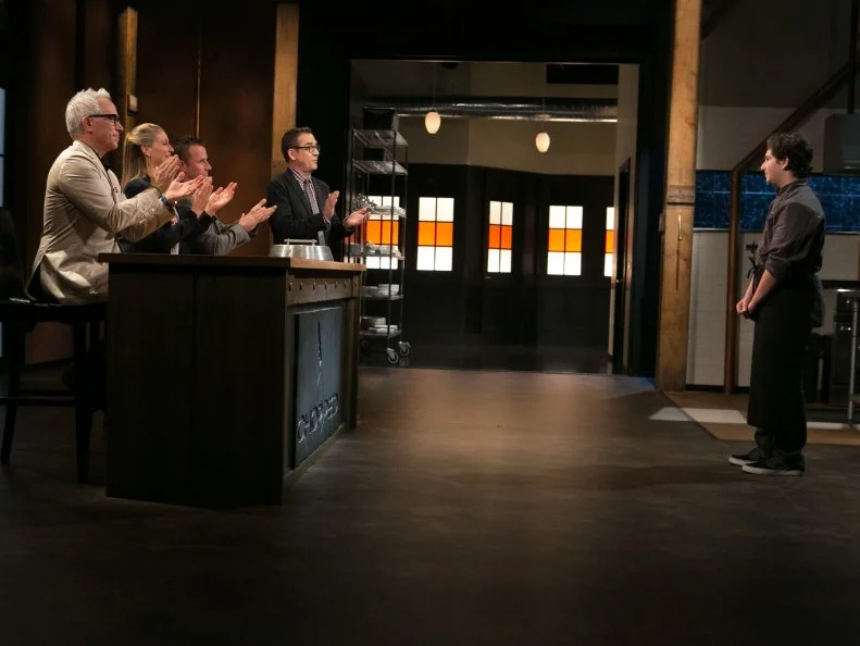Teen competitor Jason Khaytin (14) reacts to Chopped host Ted Allen and judges: Geoffrey Zakarian, Amanda Freitag and Marc Murphy revealing the he has won a spot in the Teen Championship Challenge and a chance to win $25,000 in cash and a $40,000 culinary school scholarship, as seen on Food Network's Chopped, Season 21.