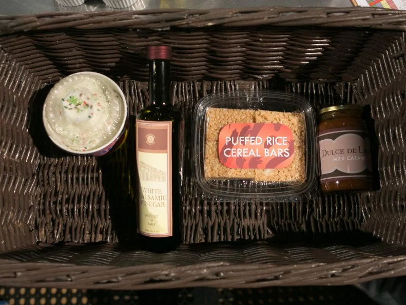 The teens dessert round mystery basket ingredients are: gourmet frozen yogurt, white balsamic vinegar, puffed rice cereal bars and dolce de leche, as seen on Food Network's Chopped, Season 21.