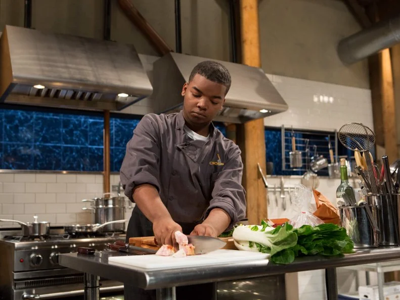 Teen competitor Dante Foggy (17) works on his entree that must include: frogs legs, mafaldine, bok choy and lobster mushrooms, as seen on Food Network's Chopped, Season 21.