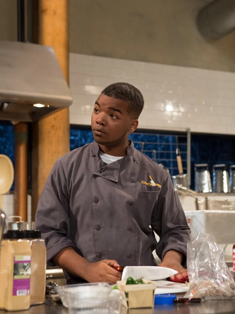 Teen competitor Dante Foggy (17) working on his appetizer that must include: jumbo shrimp, chunky peanut butter, jalapeno and sticky rice, as seen on Food Network's Chopped, Season 21.