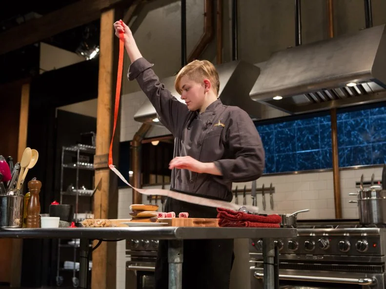 Teen competitor Lucy Felong (15) works on her dessert that must include: black and white cookies, fruit leather strips, cashews and agave nectar, as seen on Food Network's Chopped, Season 21.