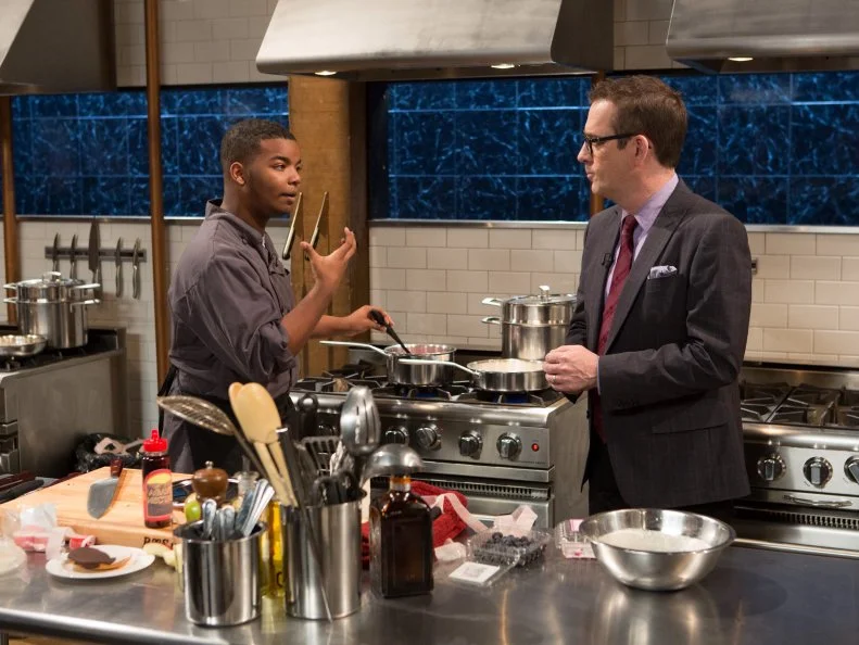 Chopped host Ted Allen checks in on teen competitor Dante Foggy (17)  as he works on his dessert that must include: black and white cookies, fruit leather strips, cashews and agave nectar, as seen on Food Network's Chopped, Season 21.