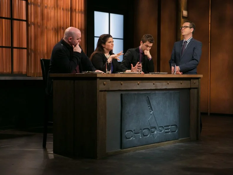 Chopped host Ted Allen and judges: Chris Santos, Alex Guarnaschelli and Alex Stupak judge and taste teen competitors: Hannah Bukzin (14), Brandon Medley (15) , Tommi Rae Fowler (16) and Max Aronson (16) and their appetizers that must have included: rabbit and ginger sausage, dandelion greens, dried currants and hot sauce candy canes as the teens compete for a slot in the Teen Challenge and a chance to win $25,000 and a $40,000 culinary school scholarship, as seen on Food Network's Chopped, season 21.