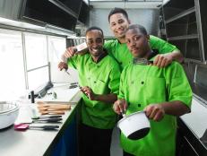 The Gourmet Graduates food truck team of Keese Chess, Burto Franco and Julius Searight takes a moment to pose for a photo in their truck on Cabrillo Blvd. in Santa Barbara, Ca. as seen on Food Network's The Great Food Truck Race, Season 5.