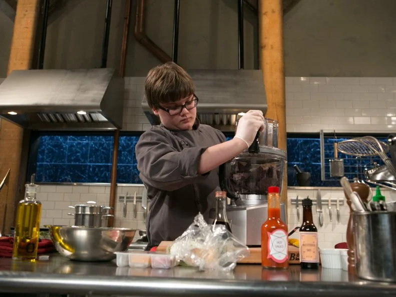 Teen competitor Jake Diamond (13) working on his appetizer that must include: salsa verde, chicken breast, bundled lunch kit and blue corn tortilla chips as he competes for a slot in the Teen Challenge and a chance to win $25,000 and a $40,000 culinary school scholarship, as seen on Food Network's Chopped, season 21.