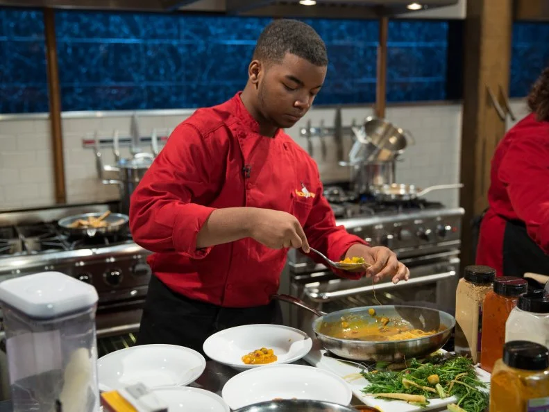 Teen competitor Dante Foggy cooks during a competition, as seen on Food Networkâ  s Chopped, Season 21.