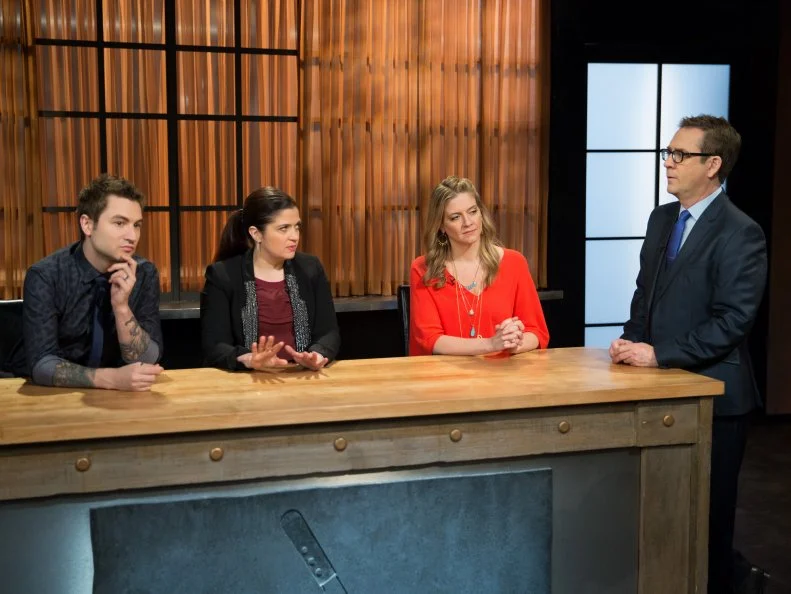 Host Ted Allen with guest judges, Alex Stupak, Alex Guarnaschelli and Amanda Freitag while they watch teen competitors working in their kitchen, as seen on Food Networkâ  s Chopped, Season 21.