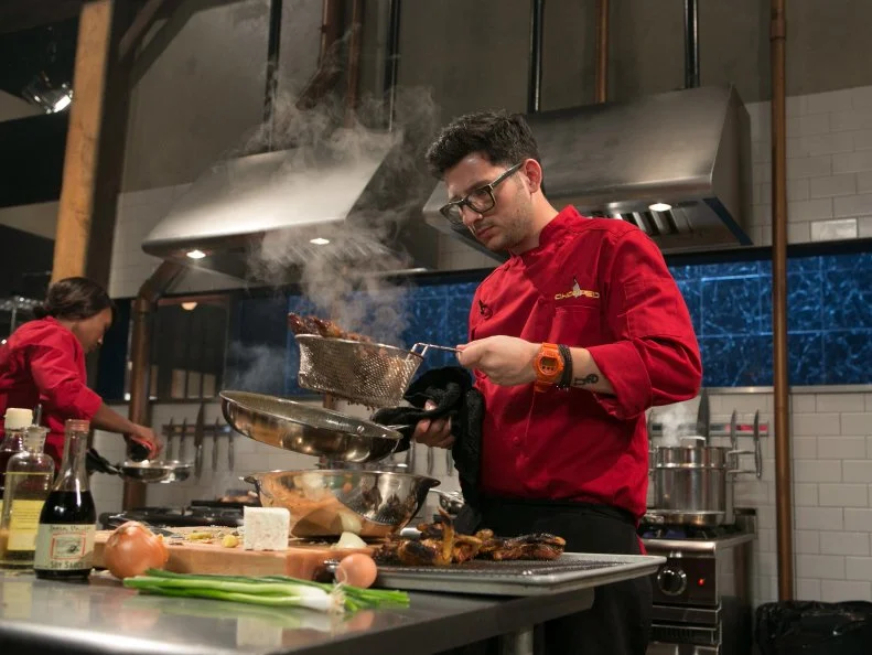 Chef Giorgio Rapicavoli works on his entree that must include: whole dressed squab, stuffed grape leaves feta cheese and cherry cola as he competes for a slot in the Chopped Ultimate Championship competition, the winner of which receives $50,000 and a new car from Buick, as seen on Food Network's Chopped, Season 21.