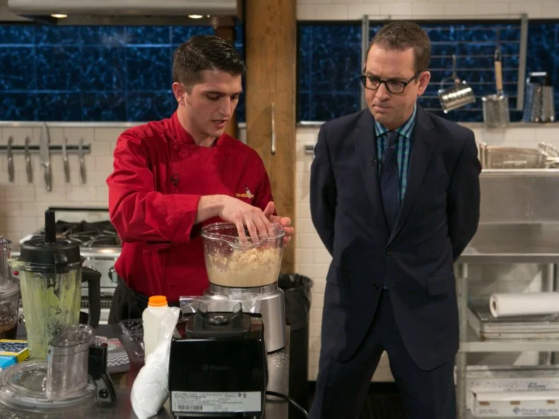 Chopped host Ted Allen checks in on chef Tom McKenna as he works on his dessert that must include: grasshopper pie, puffed rice, granny smith apples and smoked salt as he competes for a slot in the Chopped Ultimate Championship competition, the winner of which receives $50,000 and a new car from Buick, as seen on Food Network's Chopped, Season 21.