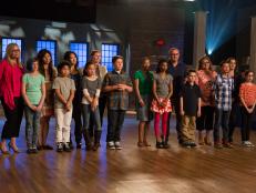 Contestants pose with their families as they learn about their challenge (L-R),  Helen's mother Jen, Helen Wilson (TG),  Sean's mother Miya, Sean Lew (TG),  Amber's mother Yokho, Amber Kelley (TG), Gibson's mother Alison, Gibson Borelli (TG),  Madison's mother Gina, Madison Grant (TR), Finn's father Renato, Finn Skerlj (TR), Luis' grandmother Georgina, Luis Ortega (TR), Lauren's mother Mariya  and Lauren Zilberman (TR) as seen on Food Network's Rachael vs. Guy: Kids Cook-Off, Season 2