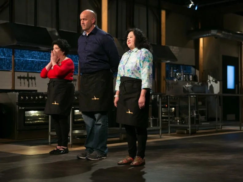 Amateur chefs: Elda Bielanski, Keith Young and Dinah Suhr stand before host Ted Allen and judges: Scott Conant, Alex Guarnaschelli and Aaron Sanchez moments before finding out which one of them has been chopped as they compete for a slot in the Chopped Ultimate Championship competition, the winner of which receives $50,000 and a new car from Buick, as seen on Food Network's Chopped, Season 21.