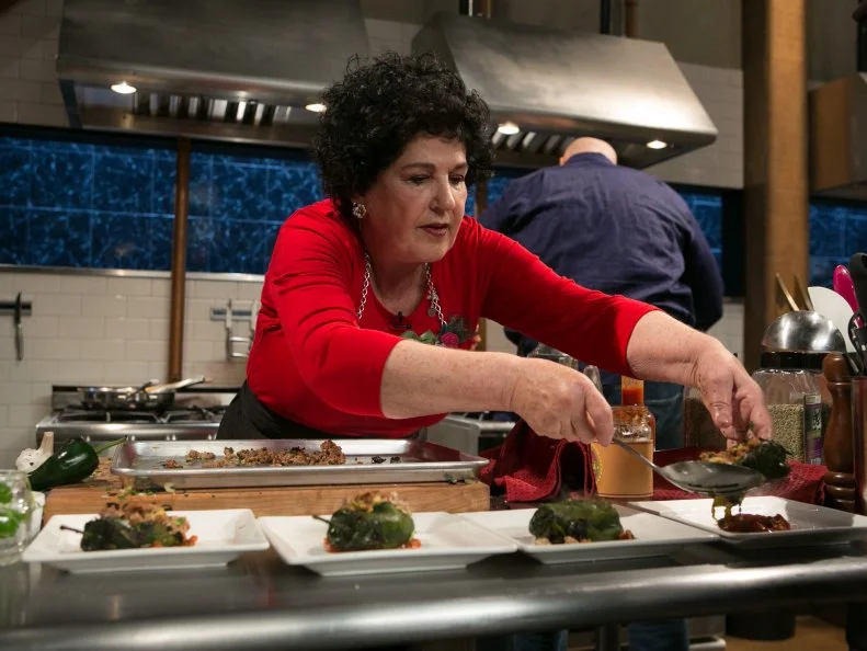 Amateur chef Elda Bielanski works on her appetizer that must include: cheese blintzes, salsa, ground pork and poblano peppers as she competes for a slot in the Chopped Ultimate Championship competition, the winner of which receives $50,000 and a new car from Buick, as seen on Food Network's Chopped, Season 21.