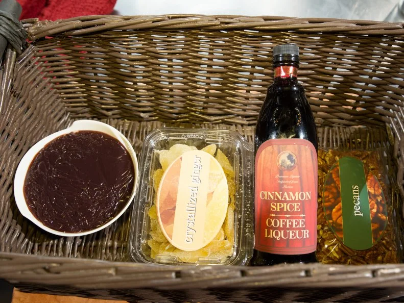 Food beauty of dessert ingredients using purple corn pudding, crystalized ginger, cinnamon spiced coffee liquor and pecans as seen on Food Networkâ  s Chopped, Season 21.