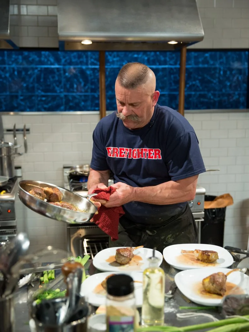 Firefighter, Chef Paul Rut completing in the Chopped kitchen, as seen on Food Networkâ  s Chopped, Season 21.