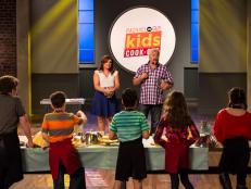 Hosts Rachael Ray and Guy Fieri match contestants to their retro foods for the "These Retro Foods are History" challenge as seen on Food Network's Rachael vs. Guy: Kids Cook-Off, Season 2