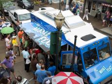 A crowd gathers as Team Middle Feast opens their doors in Mobile, Alabama, as seen on Food Network's The Great Food Truck Race, Season 5.