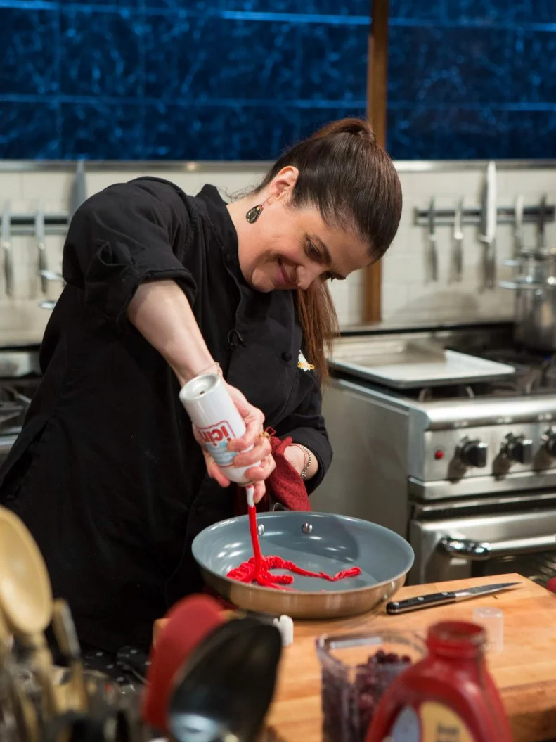 Chef Alex Guarnaschelli uses the icing as she works with the ingredients from the "short order" episode: banana pudding, vanilla ice cream, icing, brownie mix, as seen on Food Network's Chopped After Hours, Season 21.