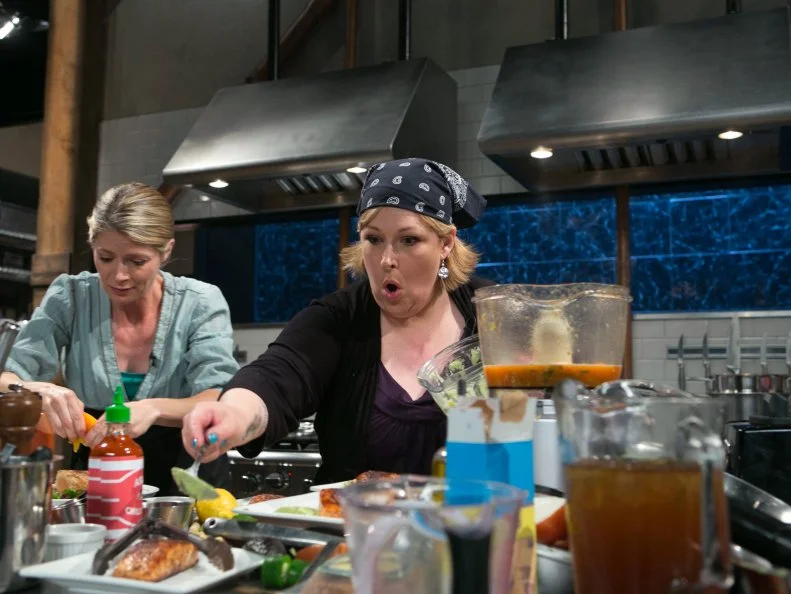 Gillian Vigman and Carnie Wilson work on their appetizers that must contain: salmon fillets, avocados, sweet tea and cricket flour as they compete for a slot in the Chopped Ultimate Championship competition, the winner of which receives $50,000 and a new car from Buick, as seen on Food Network's Chopped, Season 21.