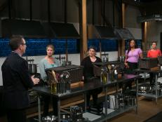 Celebrity chefs (L-R): Gillian Vigman, Carnie Wilson, Laila Ali and Brandi Chastain listen to host Ted Allen explain the rules of the appetizer round as they all compete for a slot in the Chopped Ultimate Championship competition, the winner of which receives $50,000 and a new car from Buick, as seen on Food Network's Chopped, Season 21.