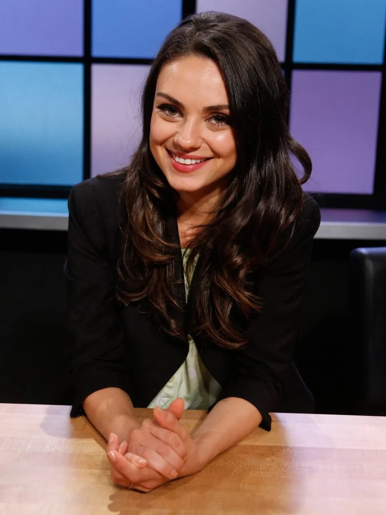Judge Mila Kunis poses, as seen on Food Network's Chopped Junior, Season 1.