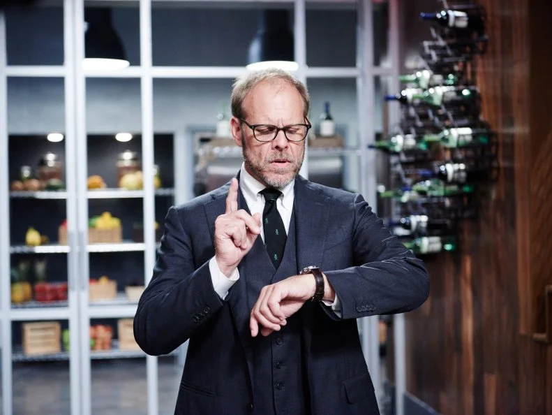 Host Alton Brown during Round 2, as seen on Food Network's Cutthroat Kitchen, Season 11.