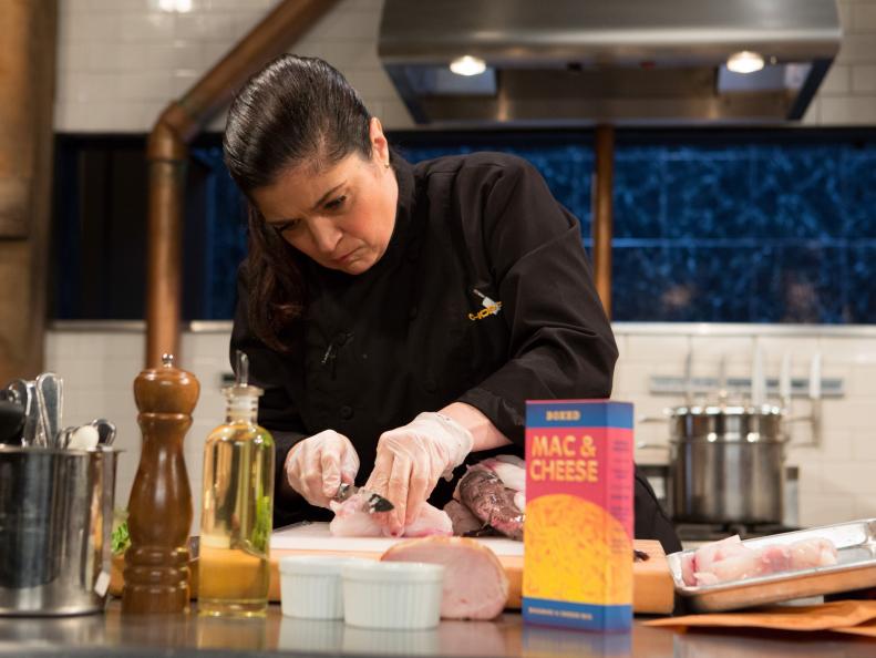 Chef Alex Guarnaschelli working on her appetizer using the mystery basket ingredients, as seen on Food Network's Chopped After Hours, Season 25.