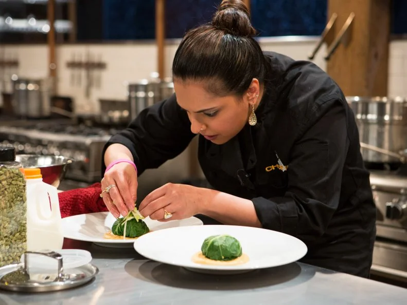 Chopped Chef Maneet Chauhan working on her appetizer using the mystery basket ingredients, as seen on Food Network's Chopped After Hours, Season 25.