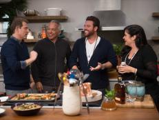 Host Bobby Flay and his guests Alex Guarneschelli, Anne Burrell, Katie Lee, Sunny Anderson, Eddie Jackson, Geoffrey Zacharian, and Scott Conant prepare dinner as seen on Food Network’s Bobby Flay’s Barbecue Addiction, Christmas at Bobby’s Special
