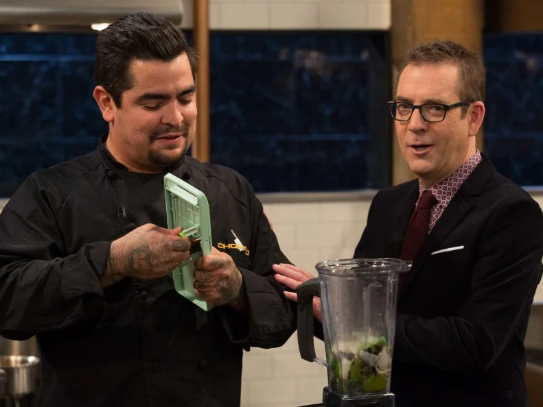 Chopped host Ted Allen checks in on chef Aaron Sanchez  as he works on his entree, as seen on Food Network's Chopped After Hours, Season 24.