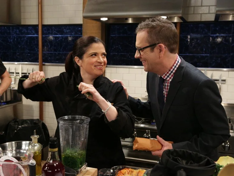 Alex Guarnaschelli and Ted Allen during a webisode with special ingredients, lasagna, arugula, onion blossom chips and ground pork, as seen on Food Network’s Chopped After Hours, Season 26.