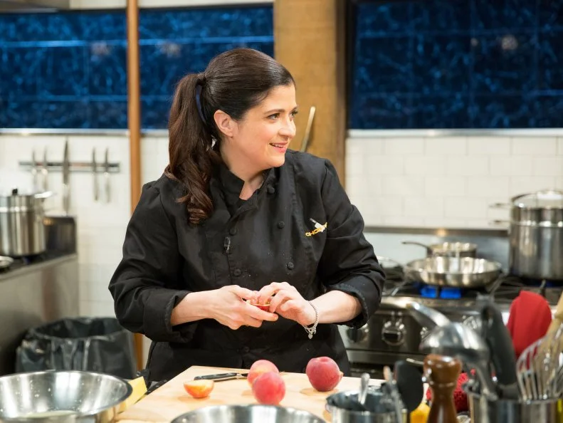 Alex Guarnaschelli cooking with lemonade, ball park peanuts, marshmallow-cereal treats and peaches, during a veteran theme webisode, as seen on Food Network’s Chopped After Hours, Season 26.