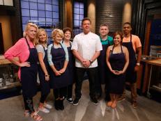 Host Tyler Florence poses with his blue team recruits on the set of Food Network's Worst Cooks in America, Season 8.