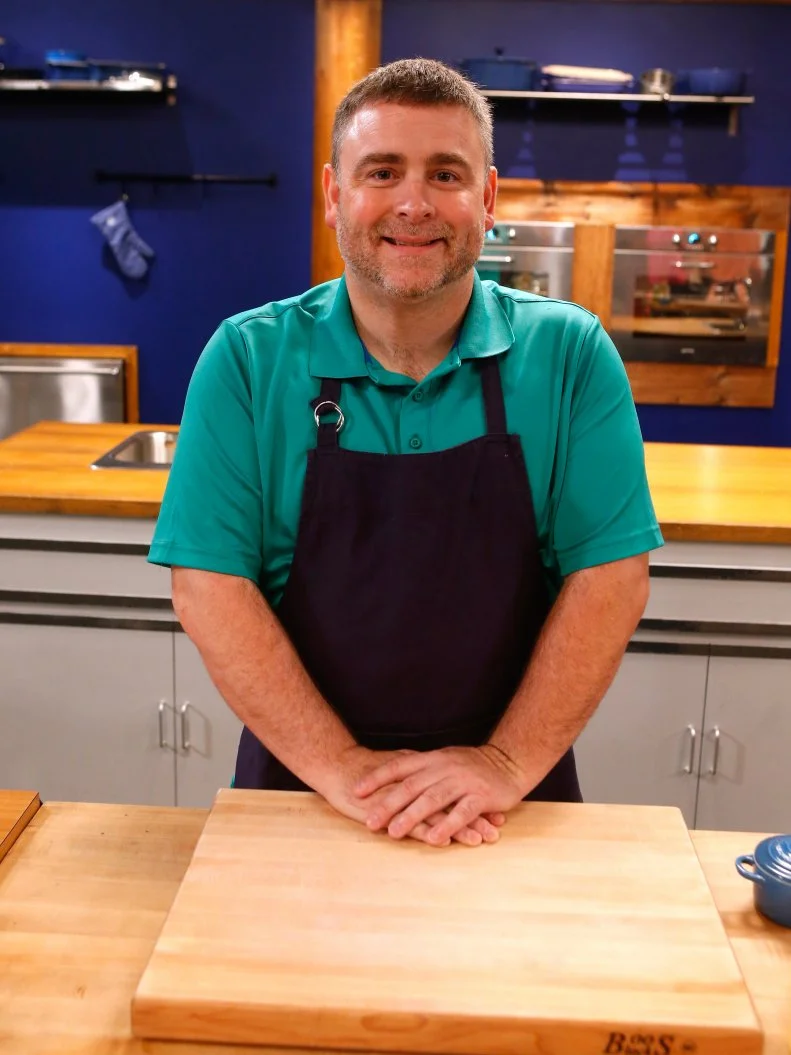 Blue team recruit Ernest Adkins poses on the set of Food Network's Worst Cooks in America, Season 8.