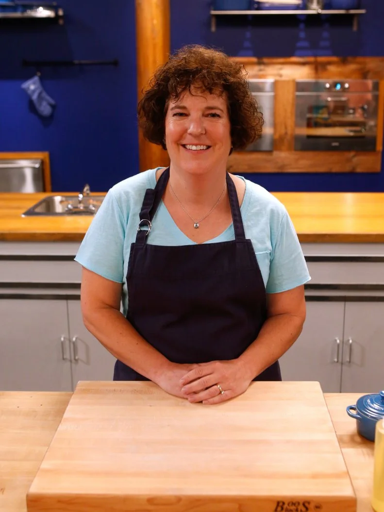 Blue team recruit Jeni Erdman poses on the set of Food Network's Worst Cooks in America, Season 8.