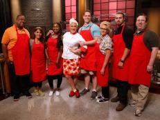 Host Anne Burrell poses with her red team recruits on the set of Food Network's Worst Cooks in America, Season 8.