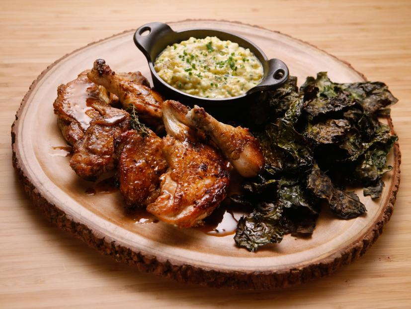 Host Tyler Florence's Sticky Brick Chicken with Creamed Corn and Kale is displayed on the set of on Food Network's Worst Cooks in America, Season 8.