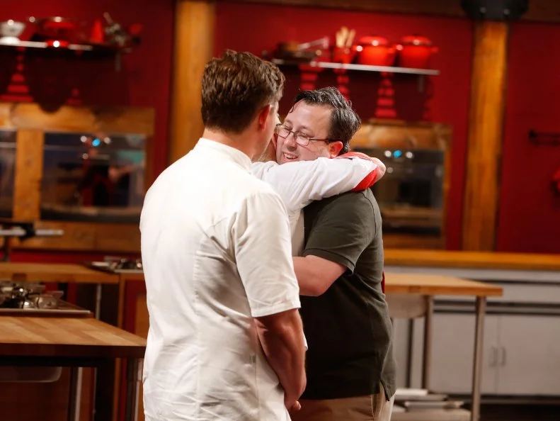 Red team recruit David Foust, right, reacts after being eliminated as seen on Food Network's Worst Cooks in America, Season 8.